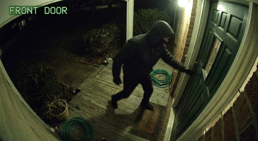 Doorbell camera view of aggressive approach at night