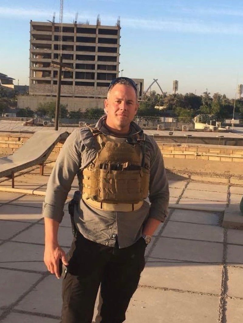 Adam Seegmiller in body armor on deployment