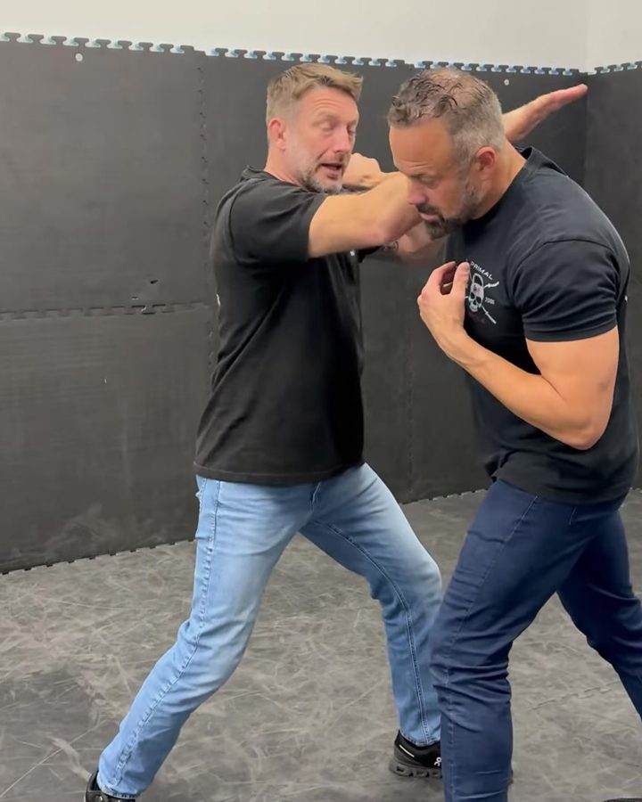 Adam stopping a punch in the training room