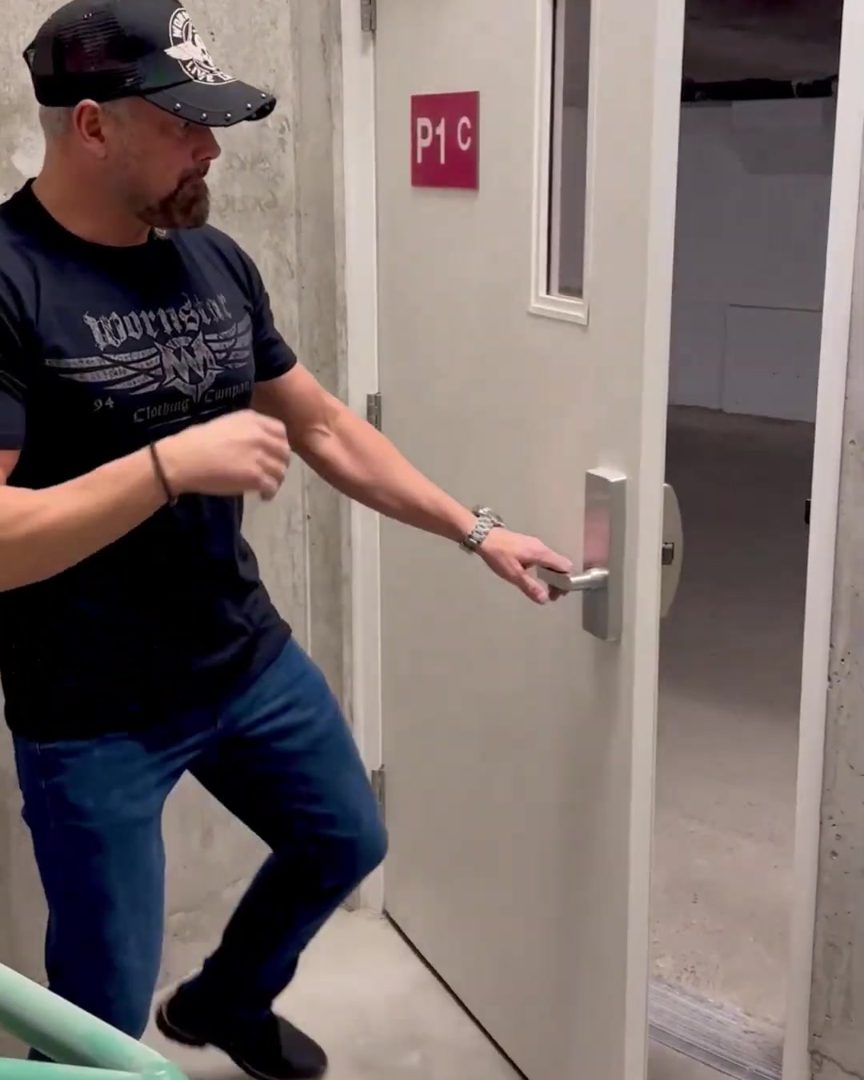 Adam opening a stairwell door from the hinge side